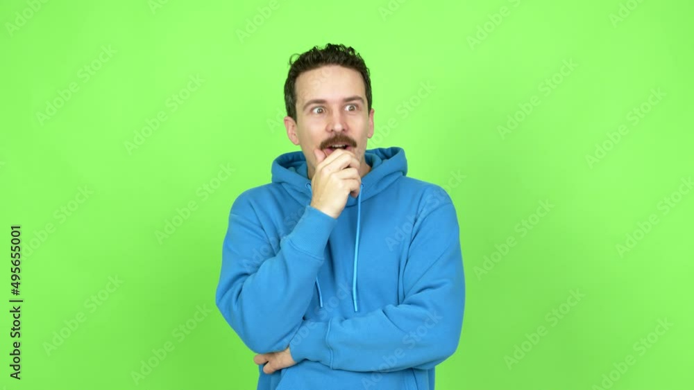 Man standing and thinking an idea pointing the finger up over isolated background. Green screen chroma key Man standing and thinking an idea pointing the finger up over isolated background. Green screen chroma key