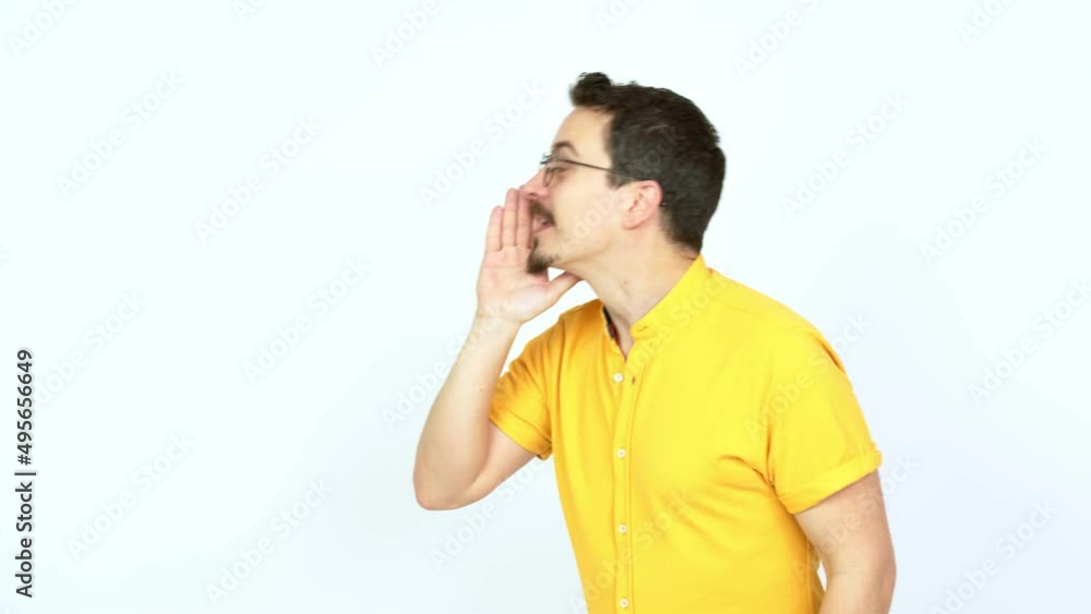 Man shouting to the lateral and announcing something over isolated background Man shouting to the lateral and announcing something over isolated background