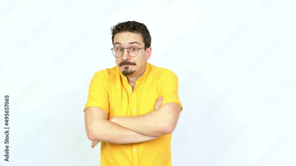 Man making unimportant and doubts gesture while lifting the shoulders and the palms of the hands over isolated background Man making unimportant and doubts gesture while lifting the shoulders and the palms of the hands over isolated background
