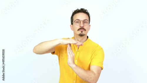 Man doing time out gesture over isolated background photo