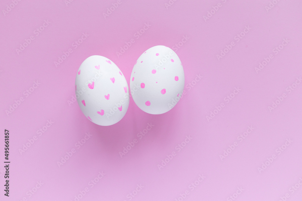 Easter layout. Decorated eggs against a pink background. Easter card. Decorate. Congratulate. Pink monochrome.