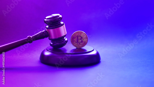 Crypto currency law theme, gavel and bitcoin symbol on black table with copyspace. photo