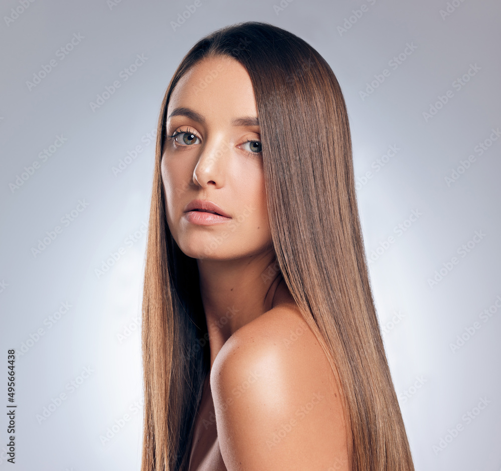 Confidence and great hair go together. Shot of an attractive young woman standing alone in the studio and posing. Confidence and great hair go together. Shot of an attractive young woman standing alone in the studio and posing.