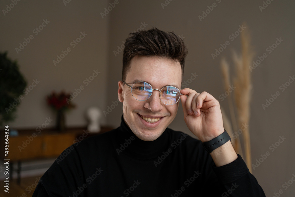 Portrait of a freelancer a man with glasses in stylish clothes working in a coworking space Portrait of a freelancer a man with glasses in stylish clothes working in a coworking space