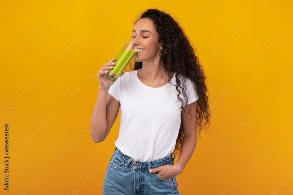 Portrait of Cheerful Young Lady Drinking Smoothie Portrait of Cheerful Young Lady Drinking Smoothie