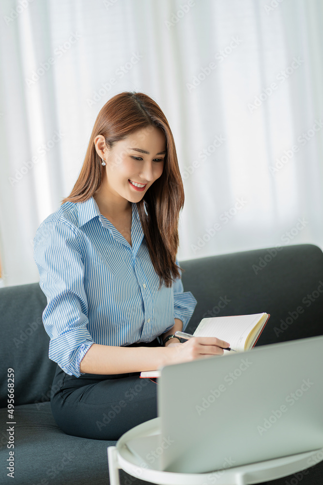 Asian businesswoman working with tiger skins notebooks graphs documents at modern desks using computers successful female e-commerce online marketing business accounting business concept Asian businesswoman working with tiger skins notebooks graphs documents at modern desks using computers successful female e-commerce online marketing business accounting business concept