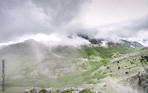 Cloudy sky over the Lovcen mountain in Montenegro captured on a foggy day photo