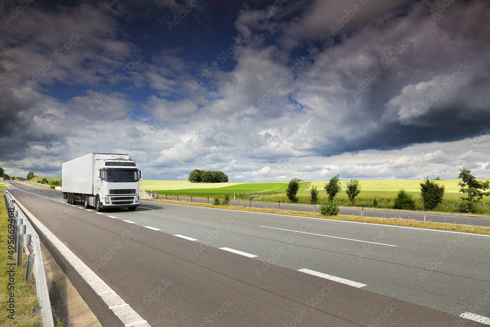 Landscape with a moving truck on the highway. Landscape with a moving truck on the highway.