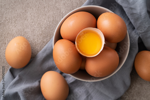 Fresh brown chicken eggs in a plate.