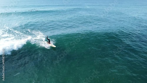 Wallpaper Mural Lifesaver and surfer catches wave and does headstand captured on a drone. Torontodigital.ca