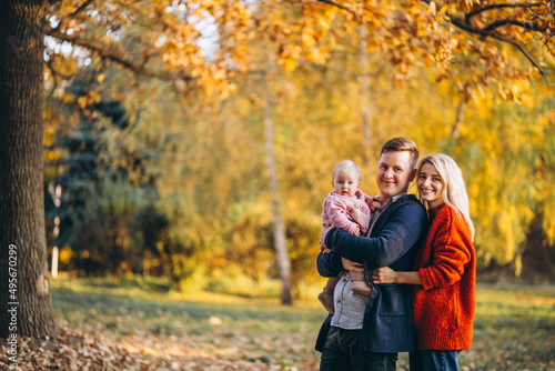 Family with baby daughter walking in an autumn park © Petro