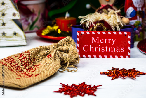 Merry Christmas sign on a table with ornaments photo