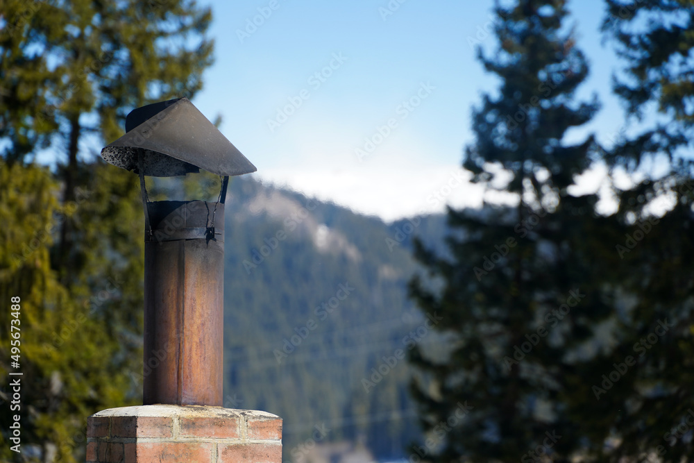 the chimney of a barbecue. photo during the day. the chimney of a barbecue. photo during the day.