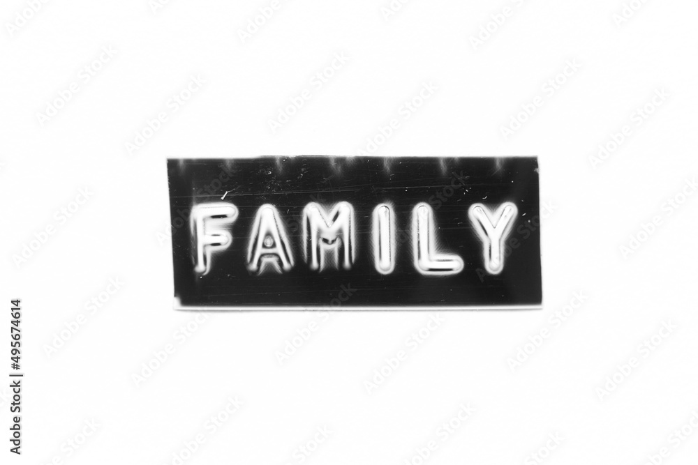 Black color banner that have embossed letter with word family on white paper background Black color banner that have embossed letter with word family on white paper background