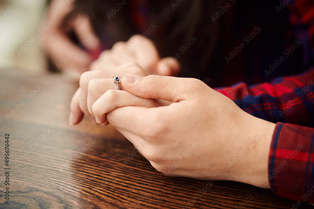 Man holding his girlfriend's hand. Man making a marriage proposal to