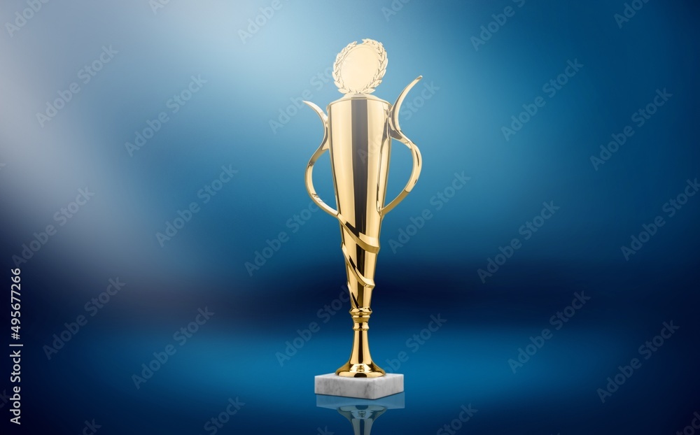 Golden  award statue on blue dark background. Success and victory concept.