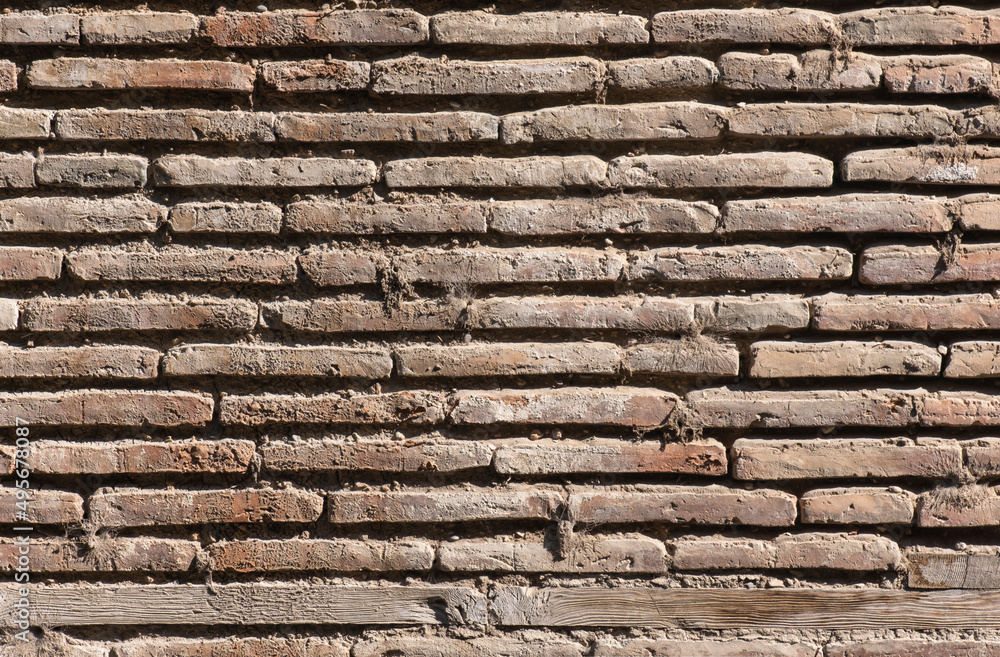 demolished brick wall of old ruined building