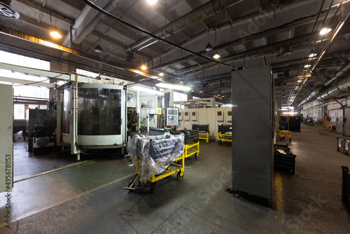 Photo of modern automatic automobile manufacturing workshop. Car production. Industrial scenery background