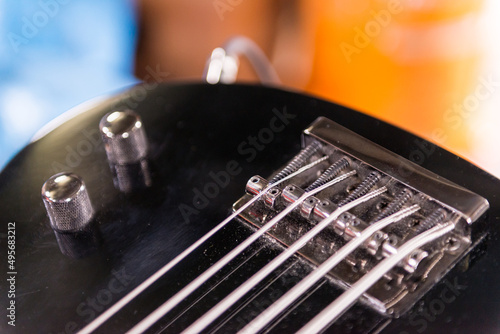 Details of a five string electric bass.