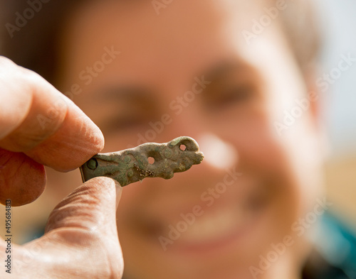 Closeup shot of Viking Age strap end in bronze, Denmark photo