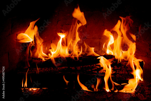 Burning fireplace, wood logs, cozy warm home