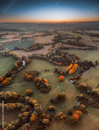 Aerial shot of a landscdape in autumn during the sunset photo