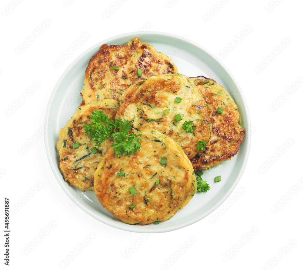 Delicious zucchini fritters with curly parsley on white background, top view Delicious zucchini fritters with curly parsley on white background, top view