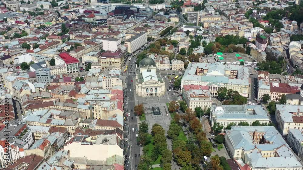 Aerial of the Lviv National Academic Opera and Ballet Theatre in Lviv Ukraine during a summer day with cars driving and old European buildings in the background Aerial of the Lviv National Academic Opera and Ballet Theatre in Lviv Ukraine during a summer day with cars driving and old European buildings in the background
