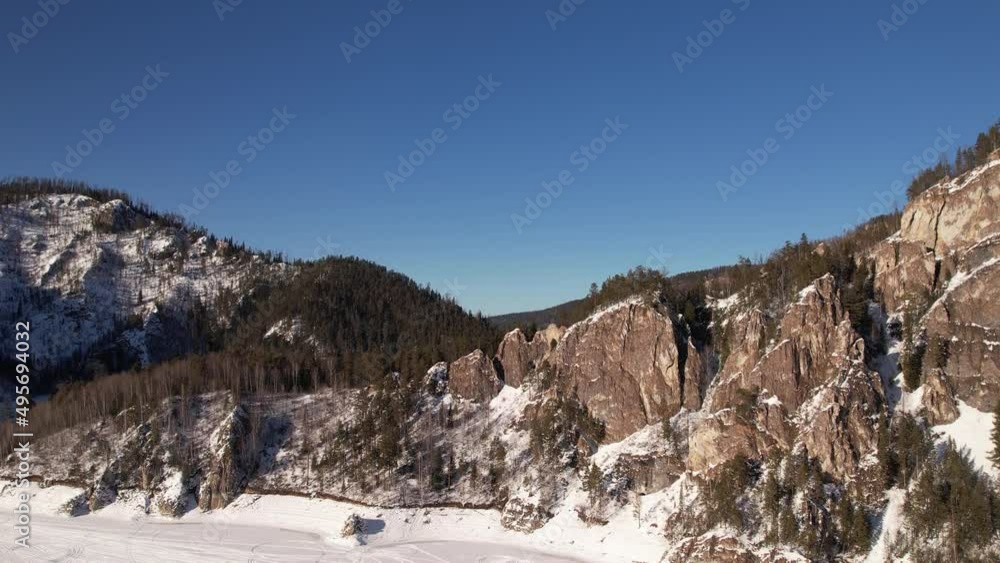 Winter landscape view of the frozen river in the national park, shot from the air. Winter landscape view of the frozen river in the national park, shot from the air.