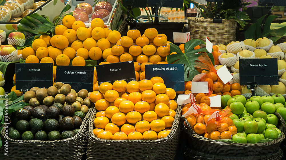 fruit in market kiwi,avocado,apple,mandarin orange