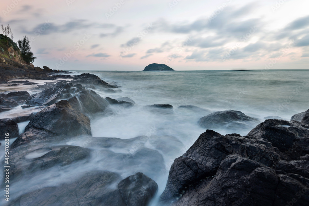 Sunset on the rocky shore.