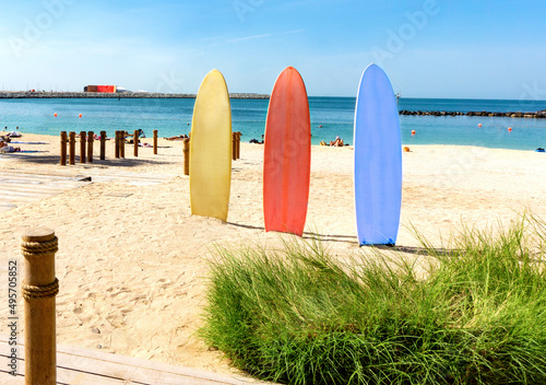 Surfboards on the beach with people