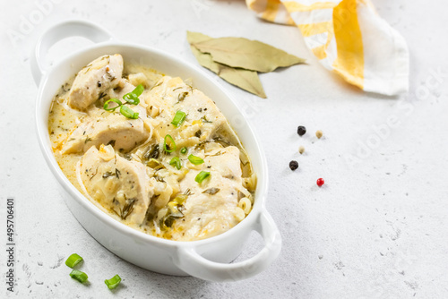 Low calorie dietitian chicken fillet coconut cream sauce in ceramic dish. Space for text.