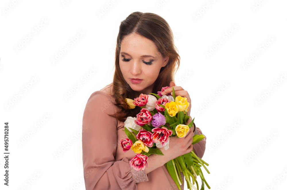 young girl with a bouquet of tulips on a white isolated background
