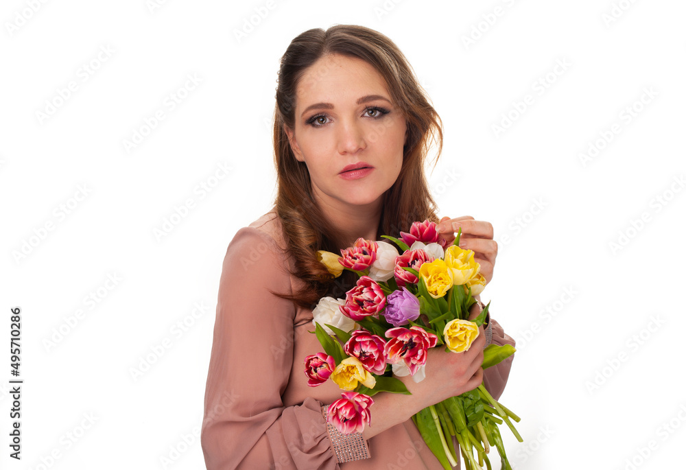 young girl with a bouquet of tulips on a white isolated background young girl with a bouquet of tulips on a white isolated background