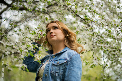 young girl walking in spring park