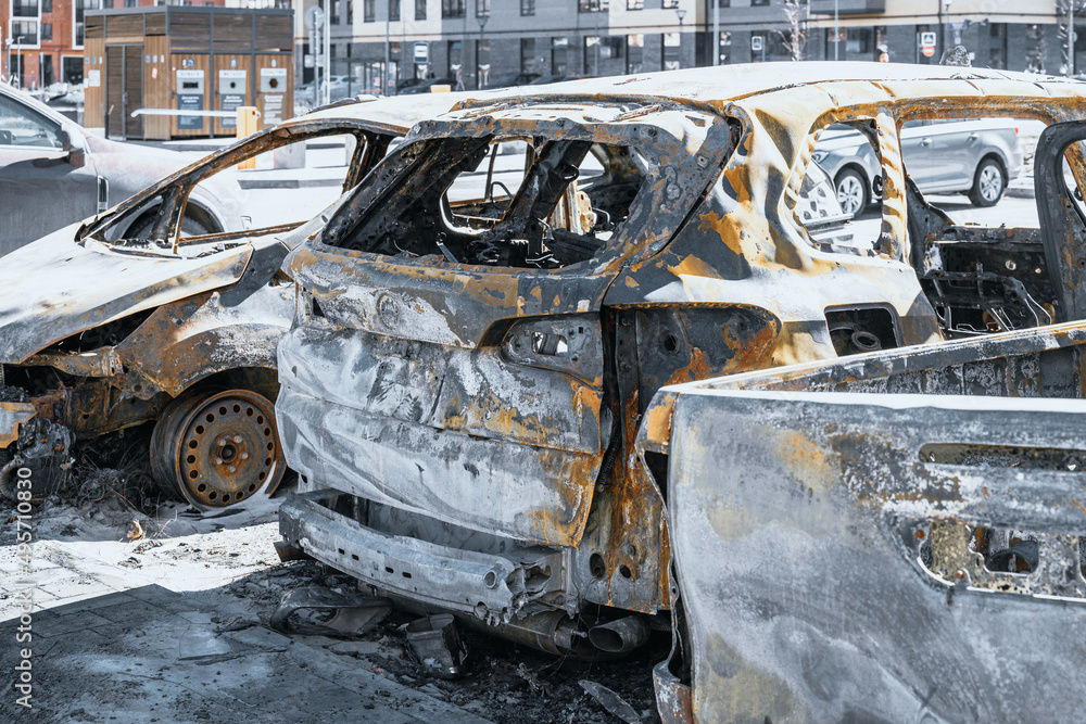 Close up photo of few burnt out cars. Not recoverable vehicles destroyed by fire. Rusty pile of metal. Insurance case. Close up photo of few burnt out cars. Not recoverable vehicles destroyed by fire. Rusty pile of metal. Insurance case.