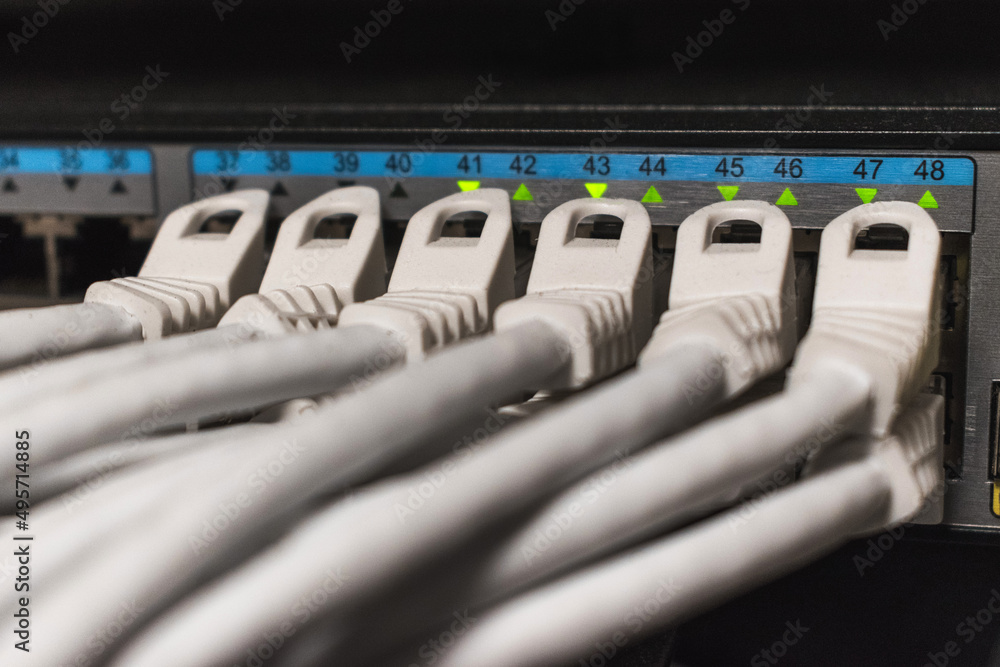  Detail of a network cables connected to a hub inside a telecommunications cabinet