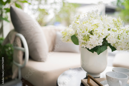 gazabo interior design,garden outdoor white armchair with coffee side table in white color theme stay in garden relax casual atmosphere ambient,home interior ideas design concept photo