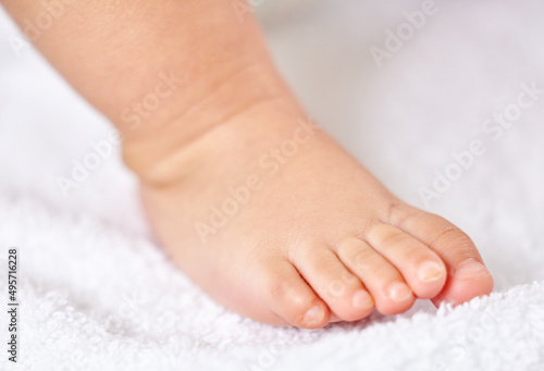 has my foot always been this chunky. Shot of a little babys foot.