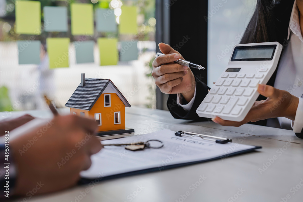 Fototapeta premium Real Estate Agent broker or House developer showing contract for buying house agreement to consultant employee