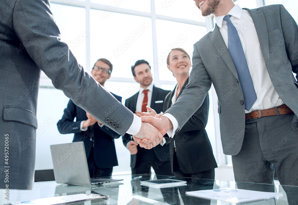 business handshake of business partners after signing the contract business handshake of business partners after signing the contract