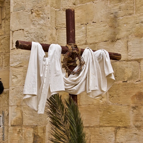 Religious Christian cross with symbols of crucifixion at Easter celebration outside a Catholic church in Malta. 