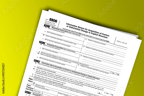 Form 8806 documentation published IRS USA 10.27.2016. American tax document on colored