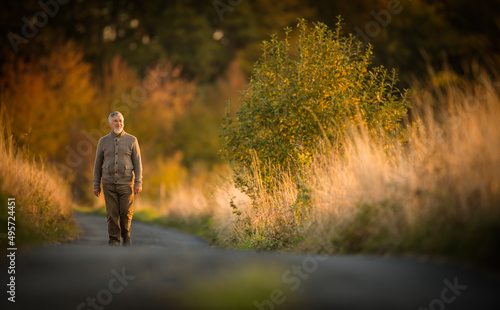 Portrait of handsome senior man in the autumn outdoors. Active senioor enjoying his retirement in the  nature © lightpoet