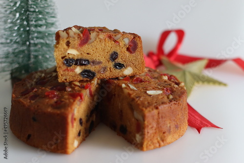 Canvastavla Sliced fruit cake with rum soaked fruits and nuts prepared for christmas