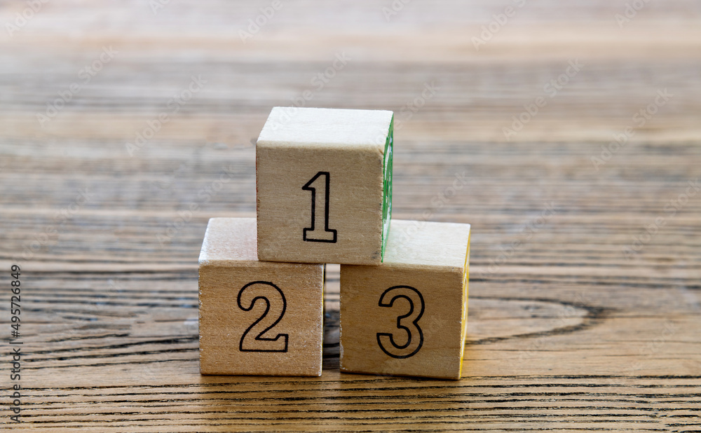 1, 2 and 3 wooden blocks on the table