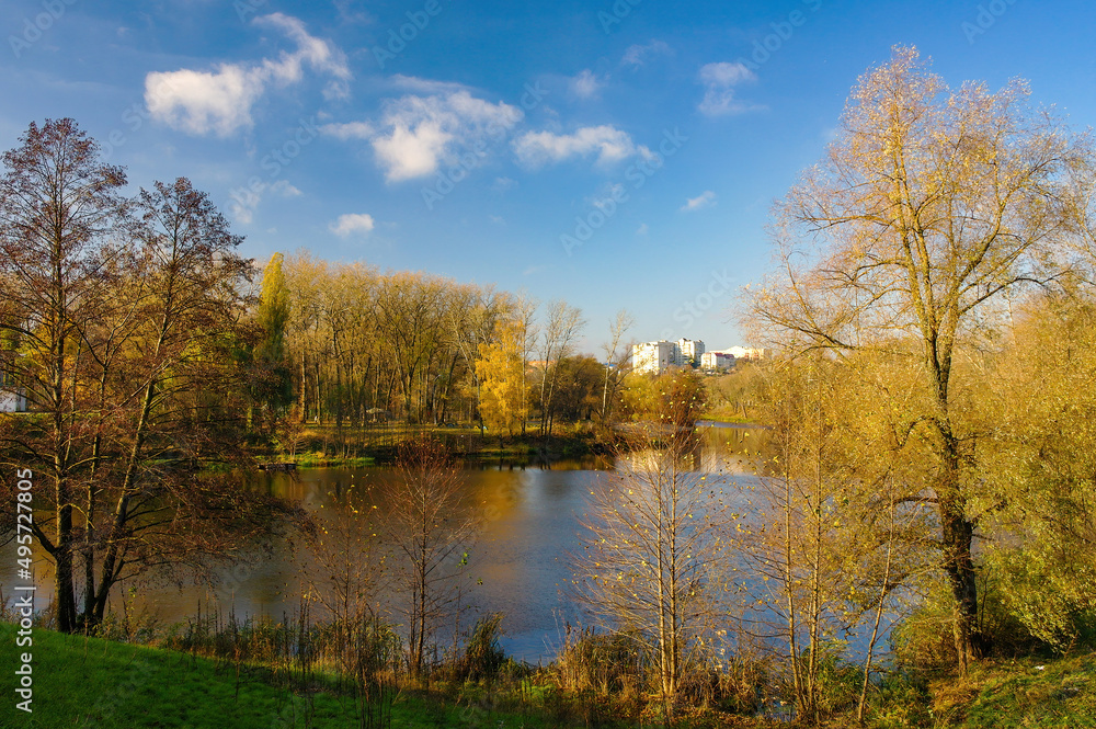 Autumn scenery of public park and Psel river in Sumy city, Ukraine