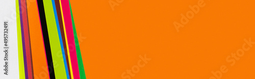 colorful background with orange copy space and multicolored stripes, banner.