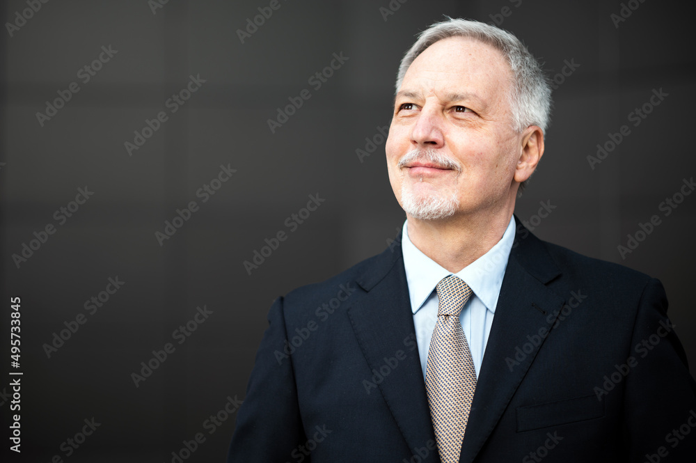 Mature business man portrait outdoor in a happy pensive expression Mature business man portrait outdoor in a happy pensive expression